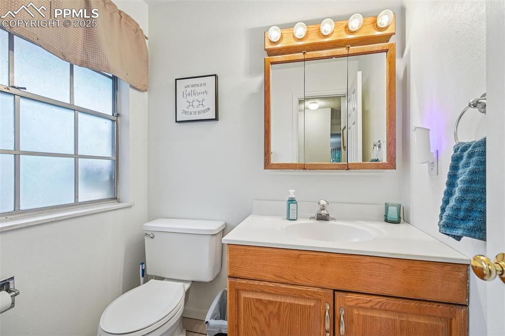 Bathroom featuring vanity and toilet
