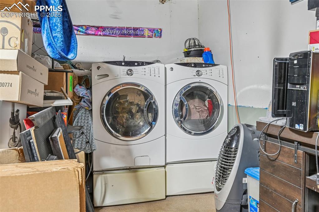 Laundry room with washing machine and dryer