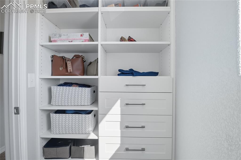CUSTOM WALK-IN CLOSET WITH BUILT-IN SHELVES