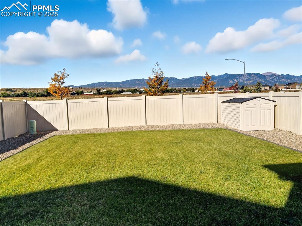 SPACIOUS, FENCED BACKYARD AND A LARGE STORAGE SHED
