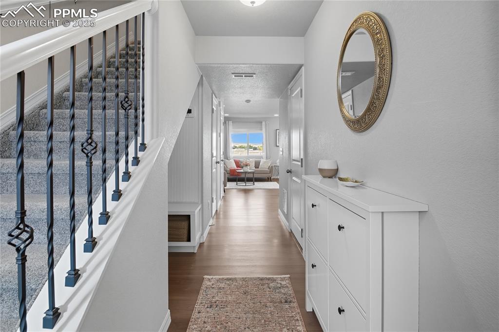 THOUGHTFULLY DESIGNED ENTRYWAY WITH A BUILT-IN CABINET