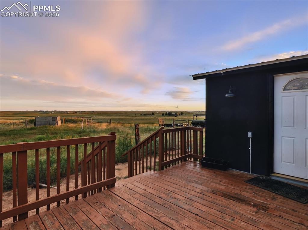 Wooden deck featuring a view of countryside