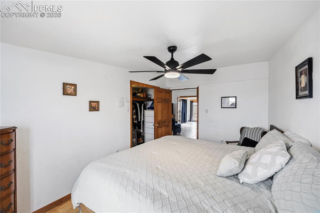 Bedroom featuring light wood finished floors and ceiling fan