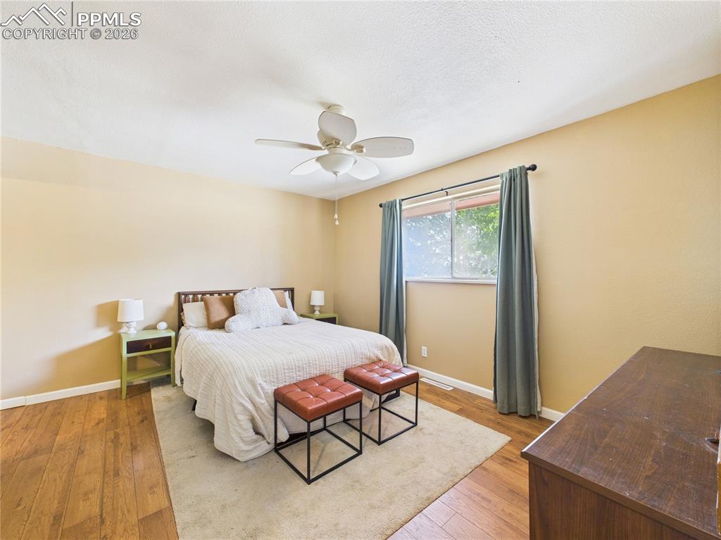 Bedroom featuring light wood-style flooring and ceiling fan