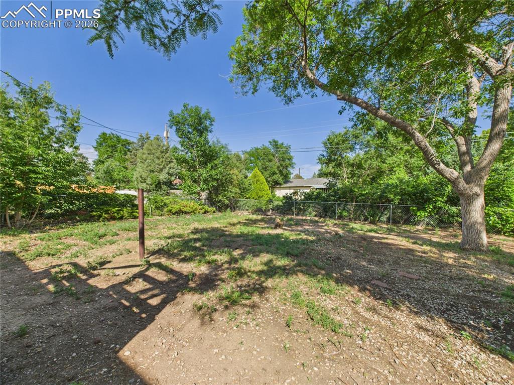 View of fenced backyard