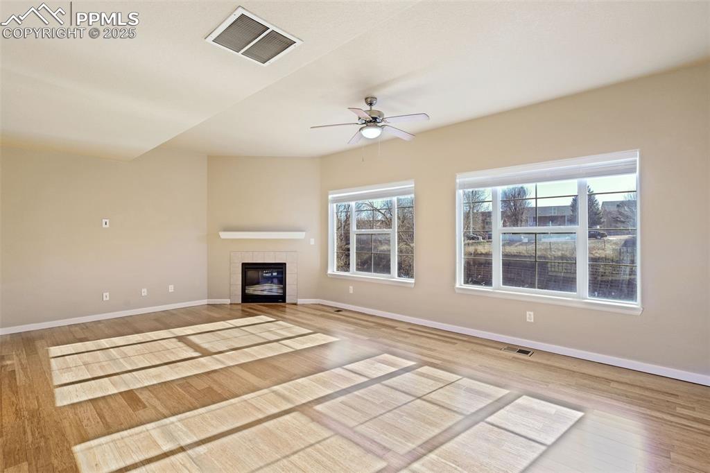 Living room with laminate flooring and lots of natural light