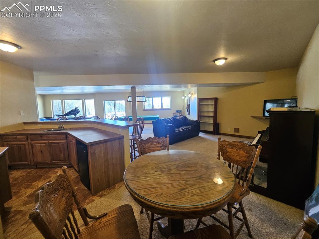 Basement recreation area off of wet bar - great for entertaining!