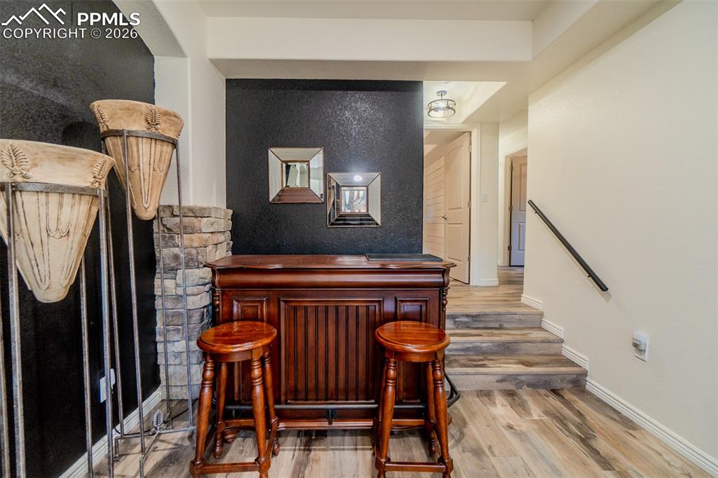 Couple of stairs to three beds and laundry room