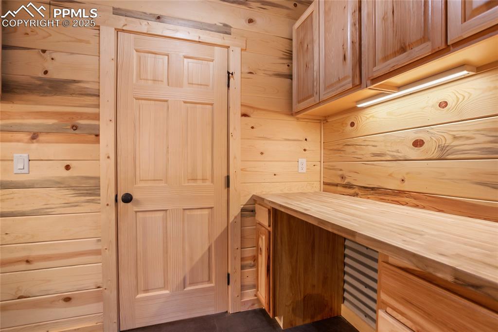 Laundry room with extra storage and counter to fold clothes on
