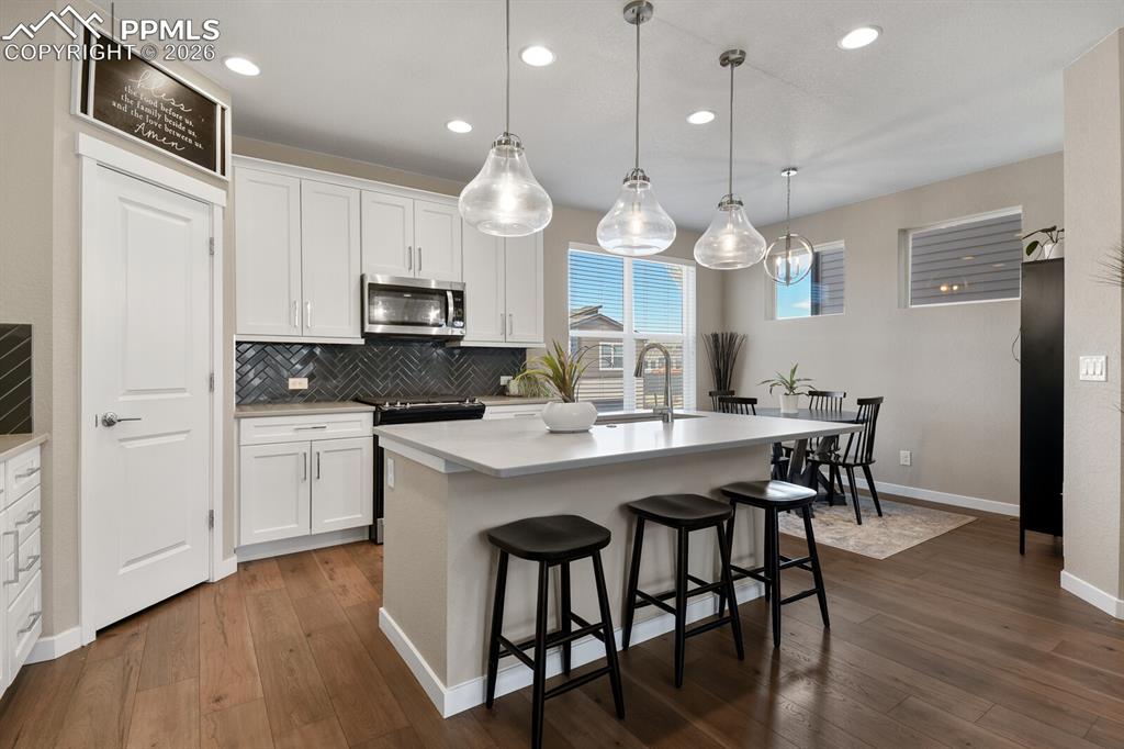 Gorgeous Backsplash Tile & Bar With Quartz Countertop 