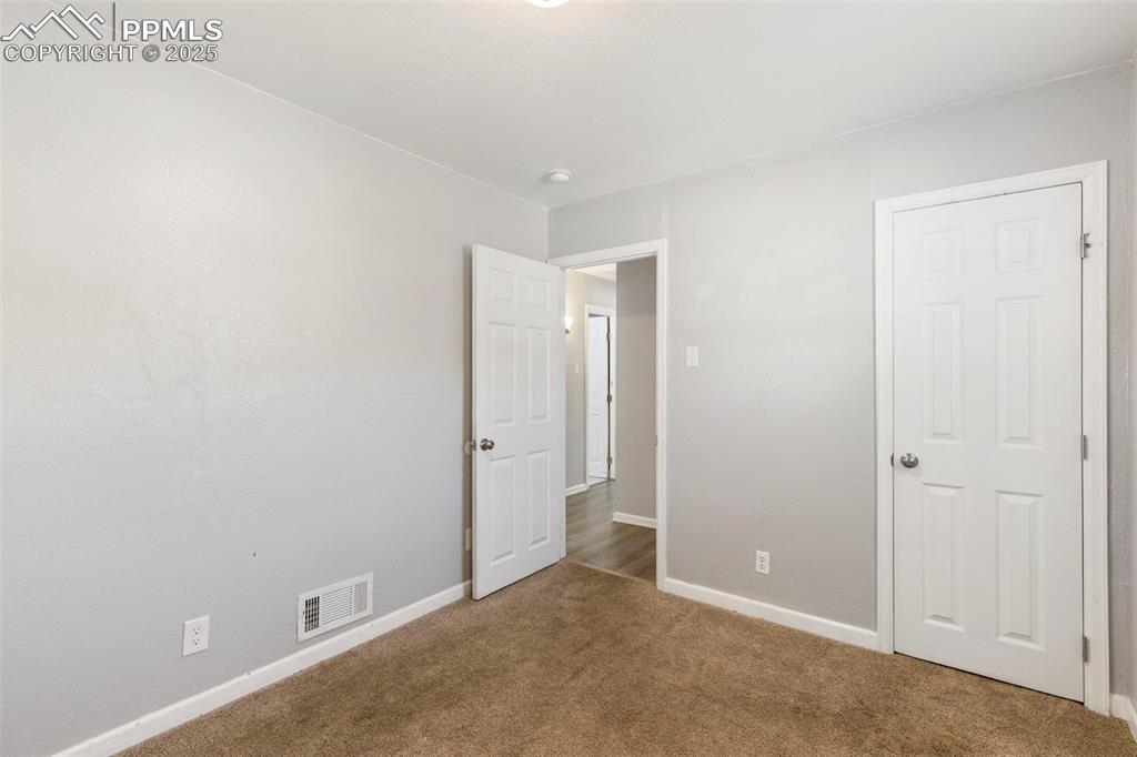 Room with baseboards and carpet