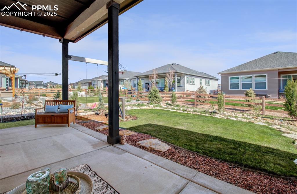 The 10 x 24 covered patio overlooks the beautifully landscaped yard