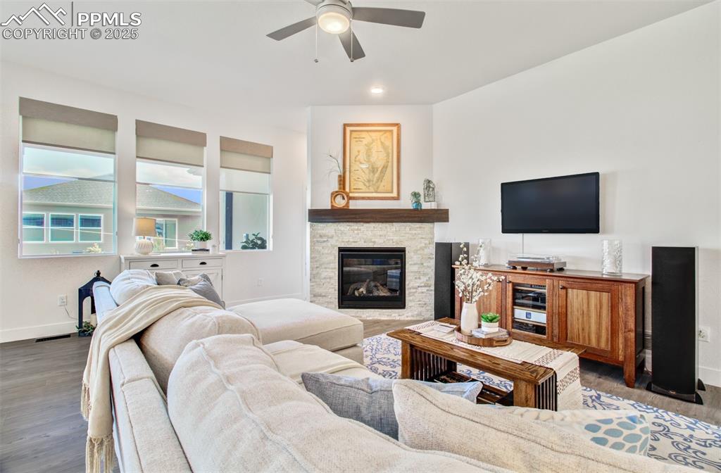 Great room features a stone gas fireplace