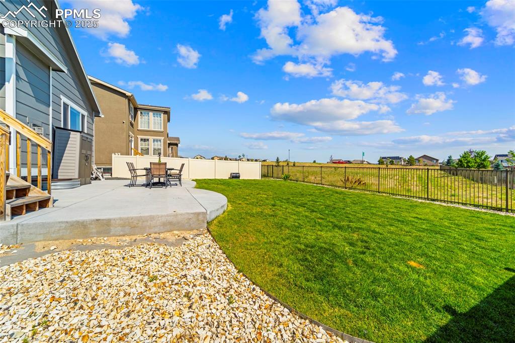 Grill here, garden here, stargaze here—this yard does it all.