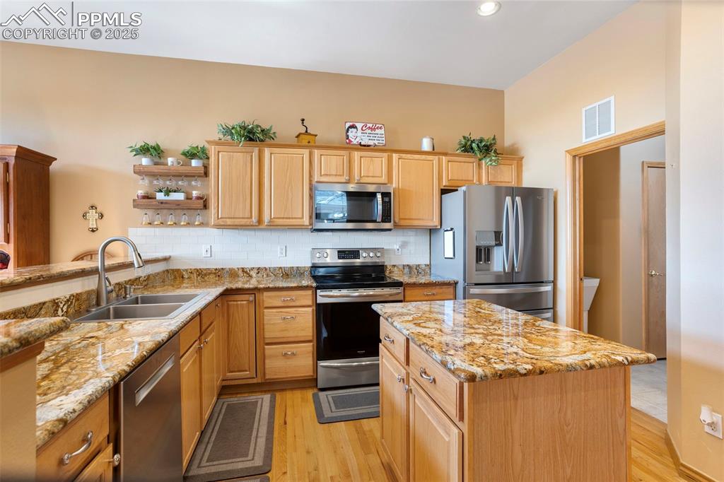 The functional kitchen leads to the laundry room and on to the garage.