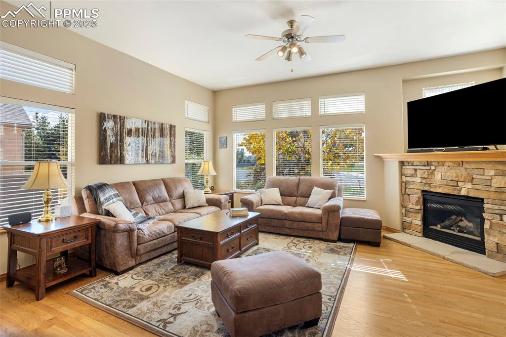 The great room is so inviting with its natural light, cozy fireplace and warm hardwood floors.