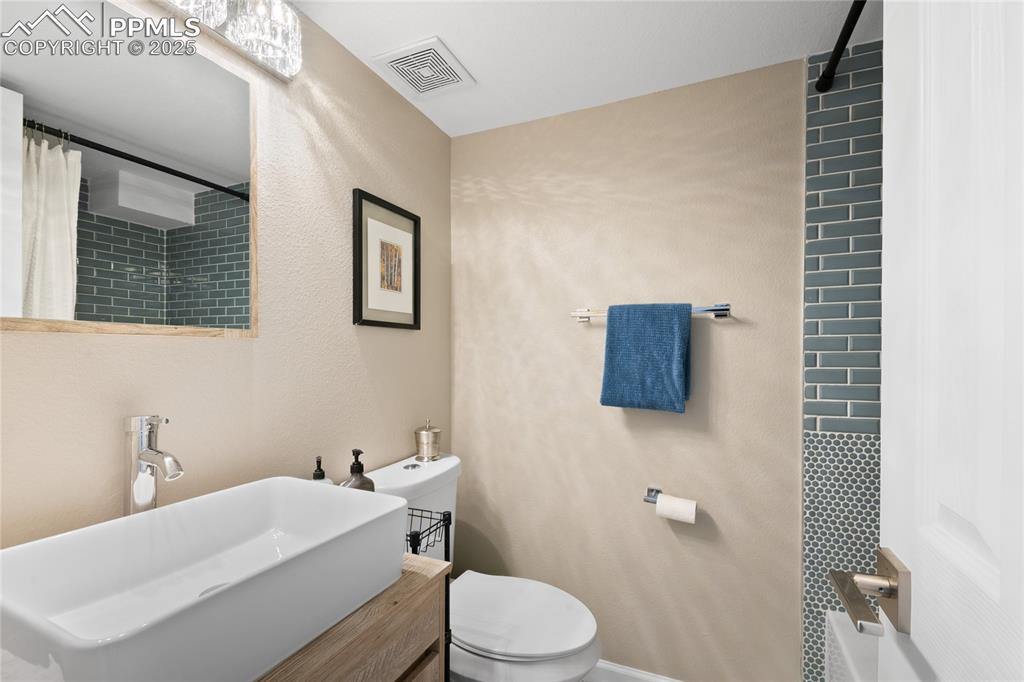 Bathroom featuring toilet and vanity