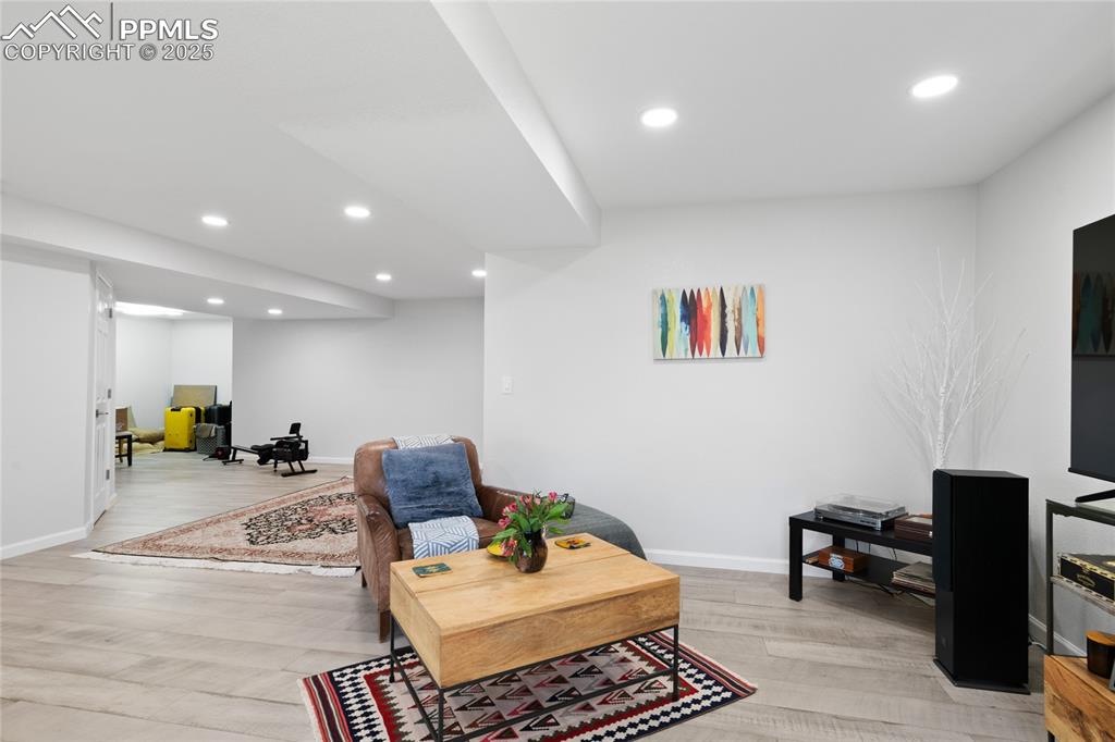 Living room featuring recessed lighting and light wood-style flooring