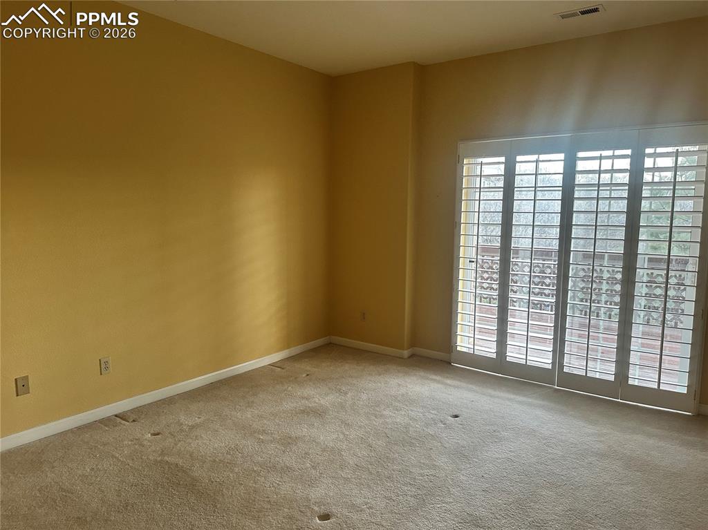 Basement bedroom with slider out to deck