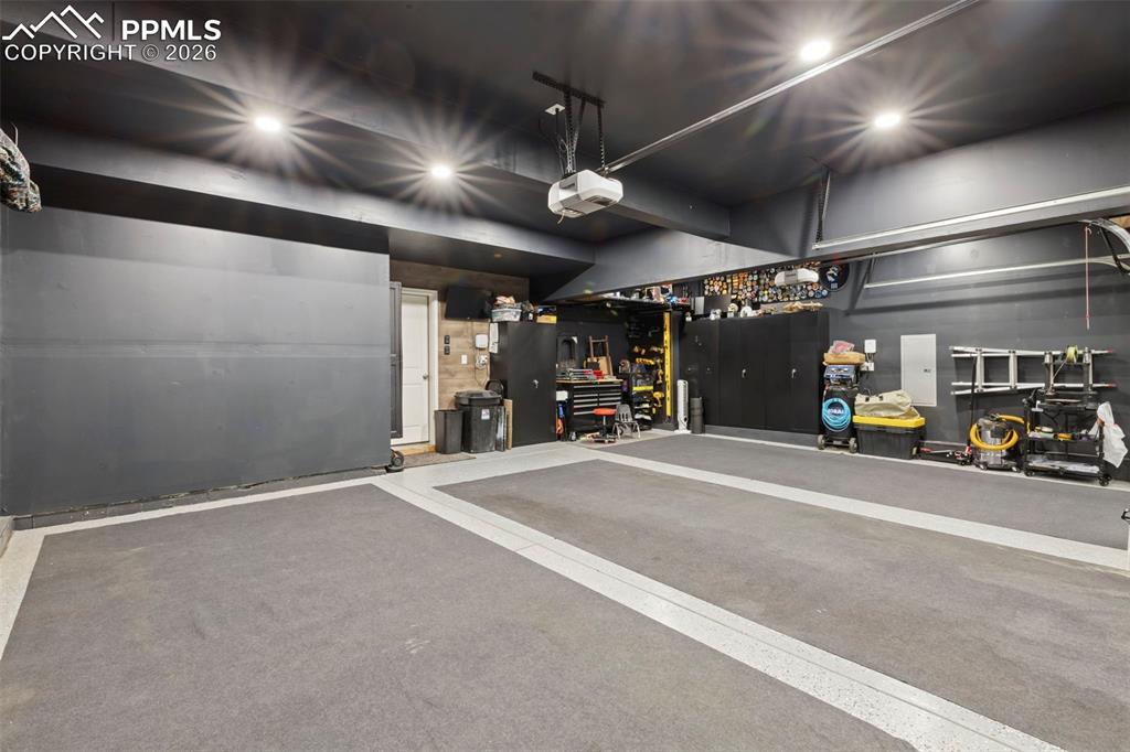 Garage featuring a garage door opener