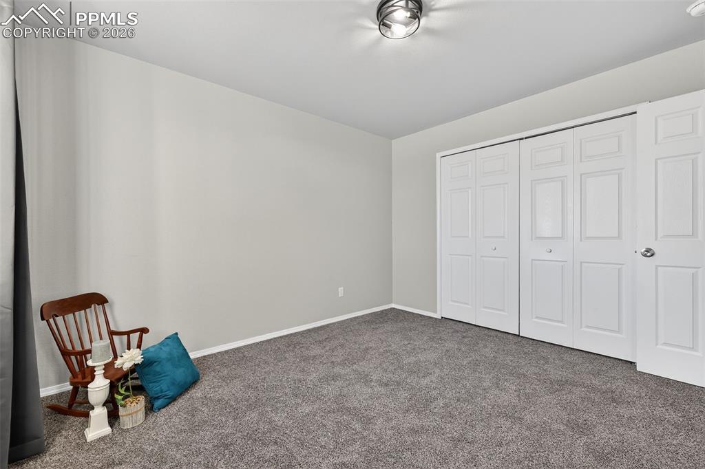 Another view of a secondary bedroom.