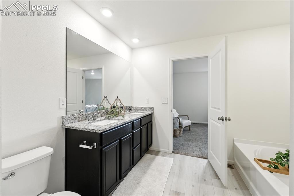 View into the Primary Suite from the Primary Bathroom.