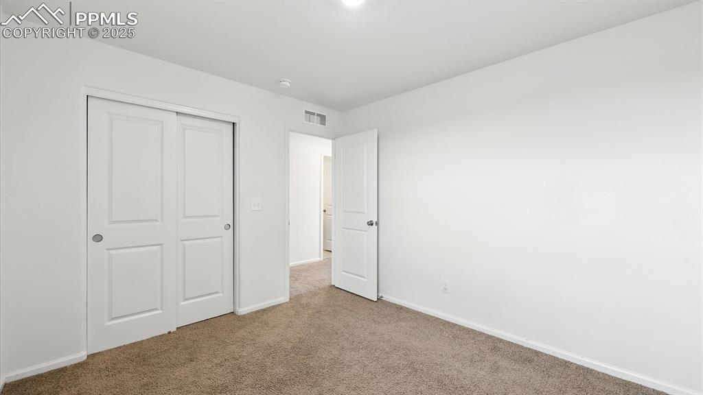 Upper Level Bedroom #2 has a generous closet.