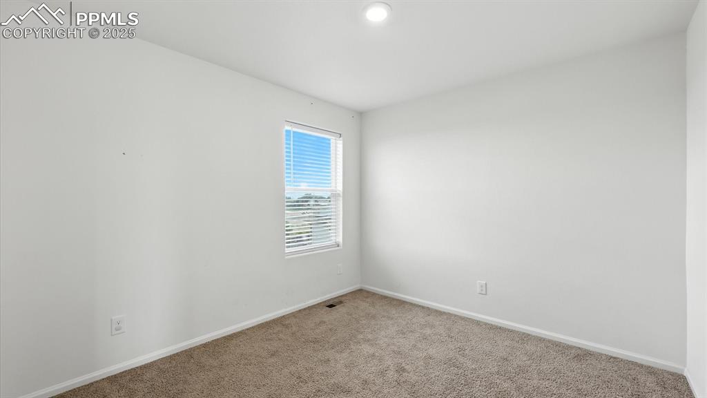 Upper Level Bedroom #3 has neutral carpet.