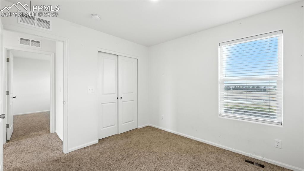 Upper Level Bedroom #3 has a generous closet.