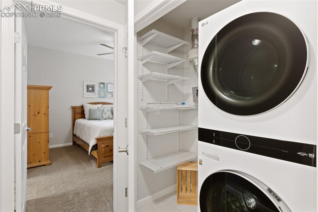 Laundry area with stacked washer / dryer