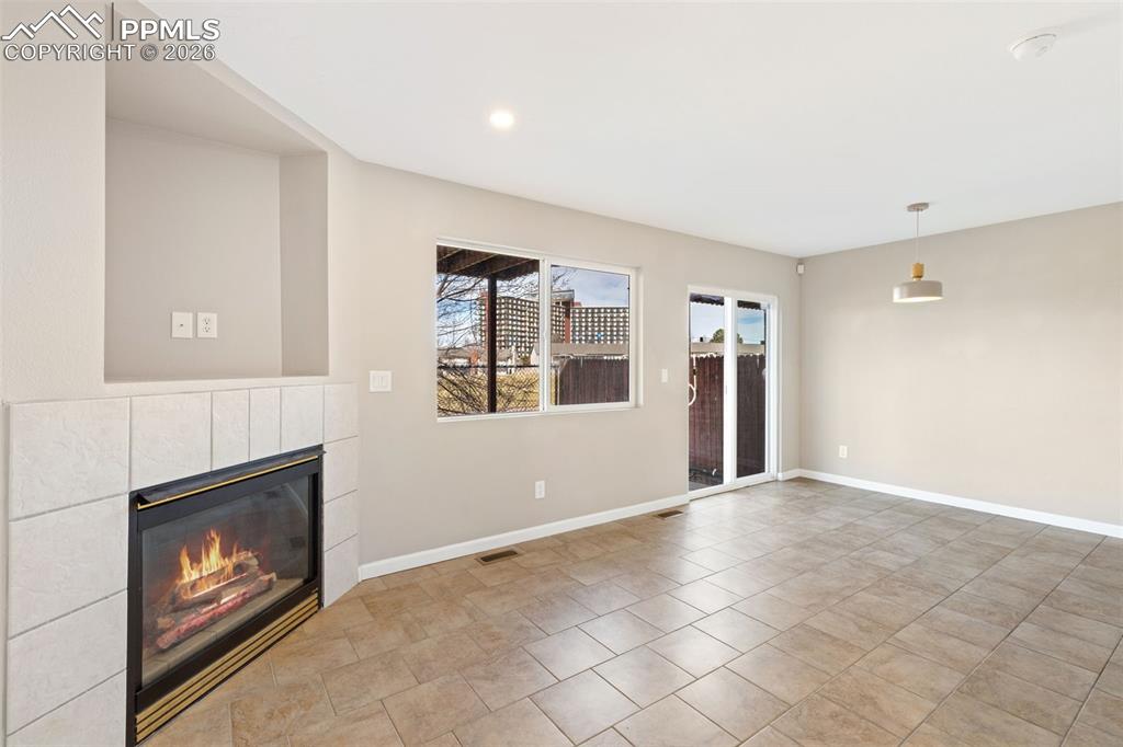 Another view of living room and dining area, and walk-out.