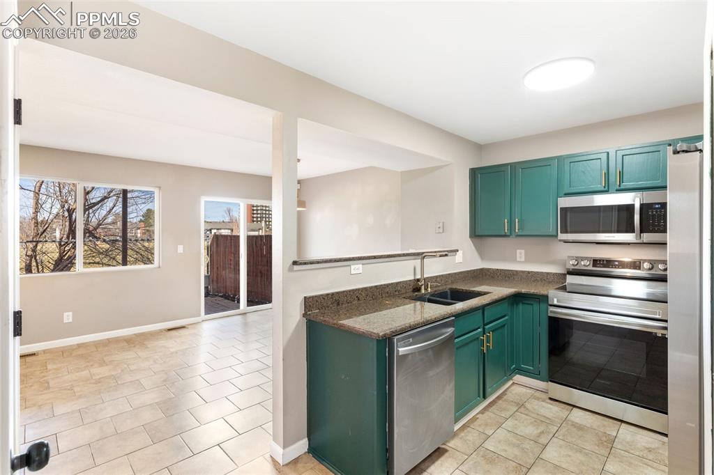 Updated kitchen with granite counters, updated hardware, pantry, and matching appliance suite!