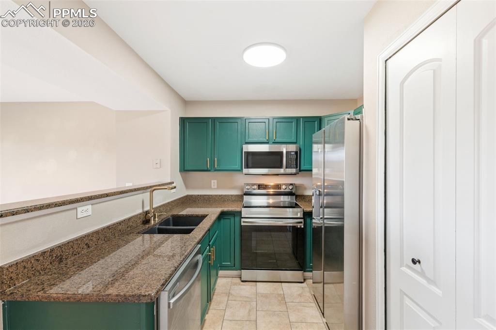 Updated kitchen with granite counters, updated hardware, pantry, and matching appliance suite!