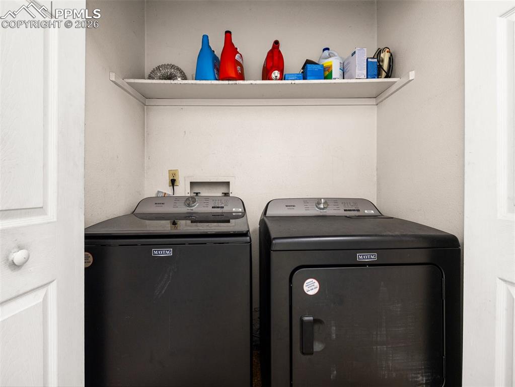 Laundry area featuring separate washer and dryer
