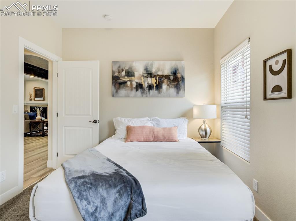 Main level bedroom provides multi-generational space, or a perfect private office or playroom space.
