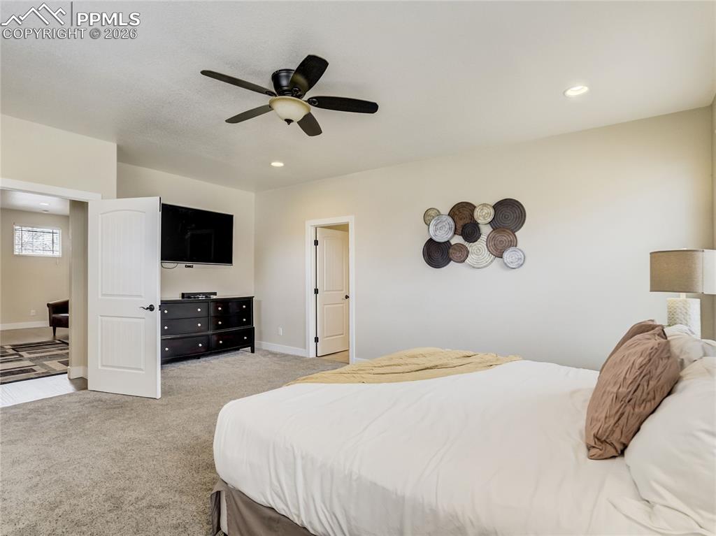 The primary bedroom is accessed through the loft space by French Doors.
