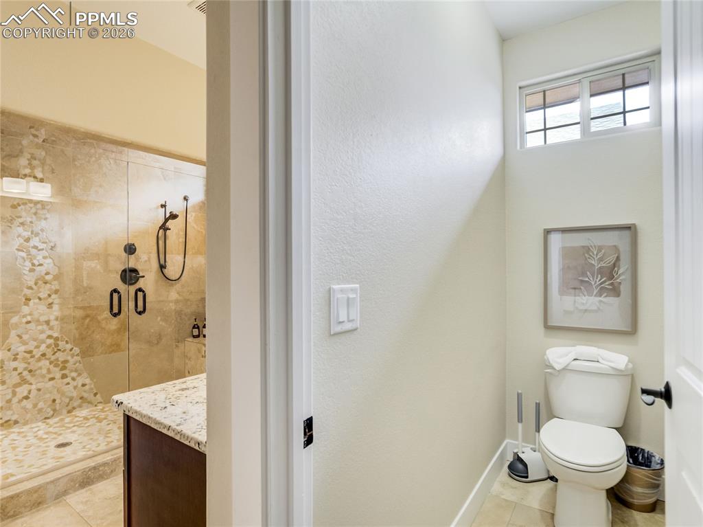 The primary bathroom has a private water closet.