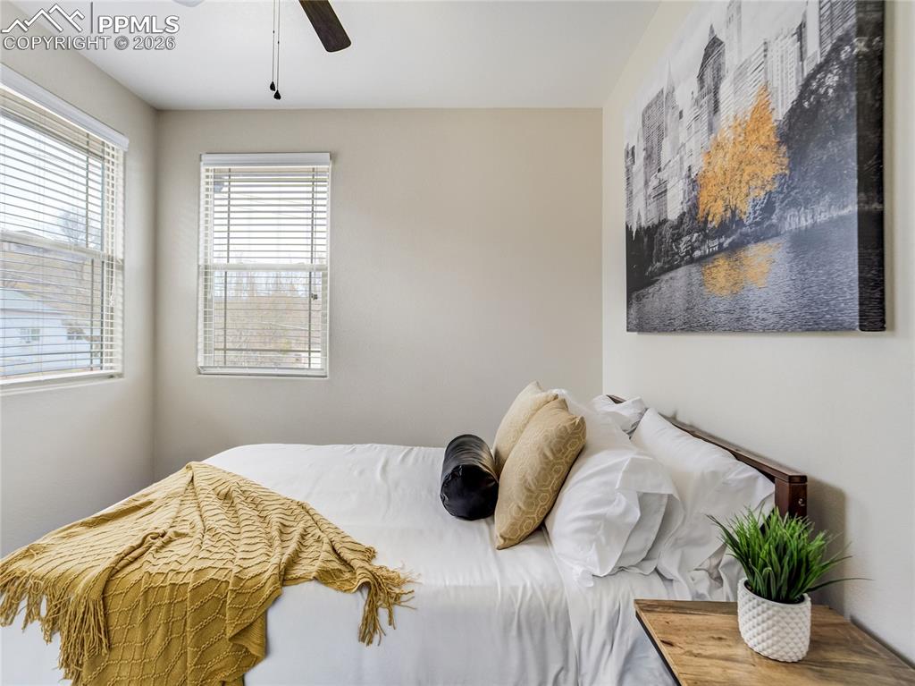 4th bedroom on the upper level features beautiful corner windows to capture natural light.
