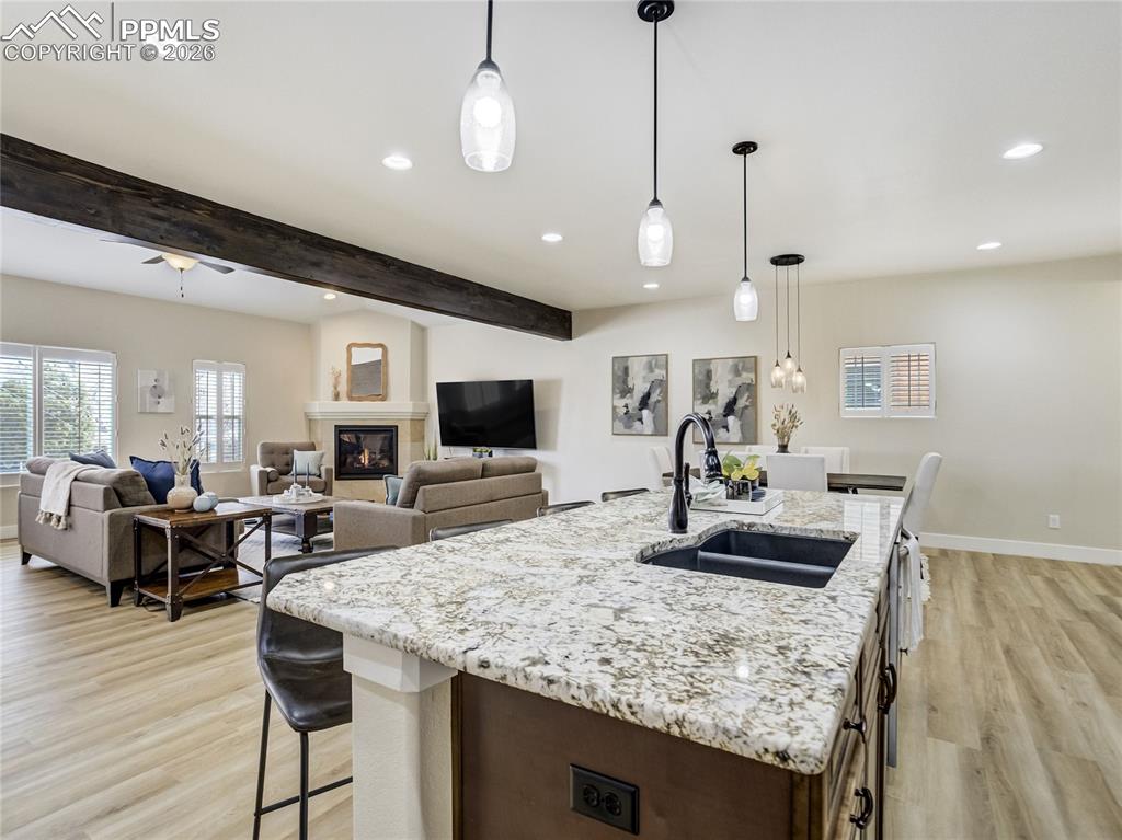 Designed for gathering, the kitchen island anchors the kitchen while opening to the great room.