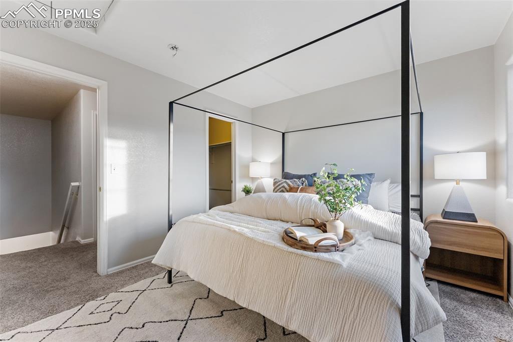 Bedroom with carpet and baseboards