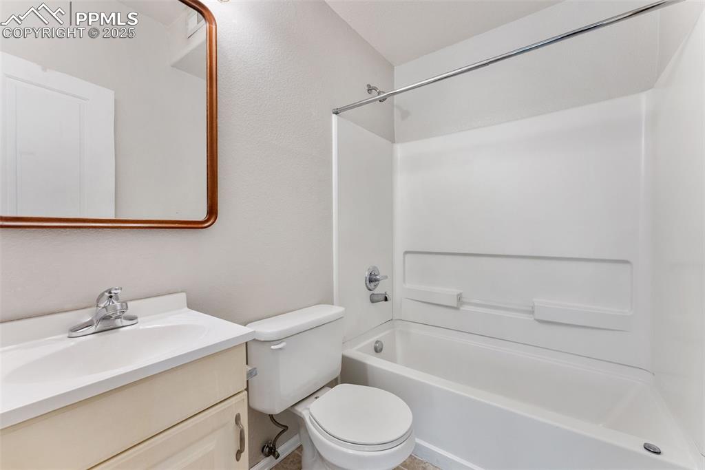 Full bathroom featuring shower / washtub combination and vanity