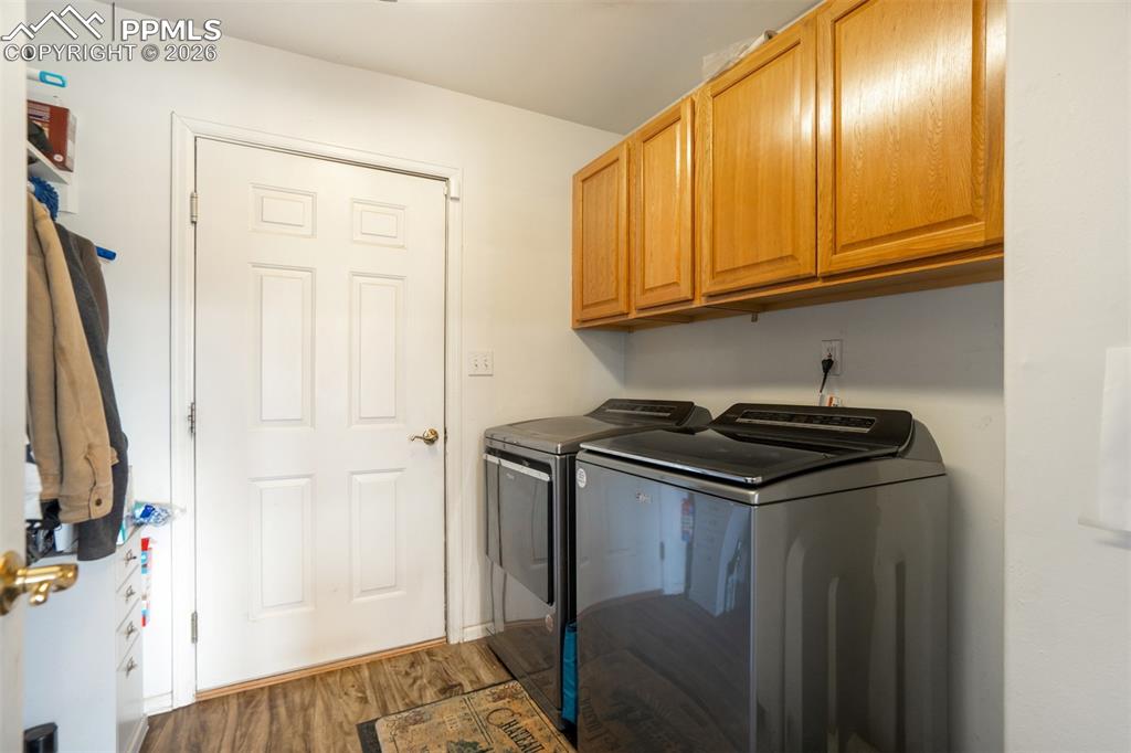 Laundry room with cabinet space, and on main level