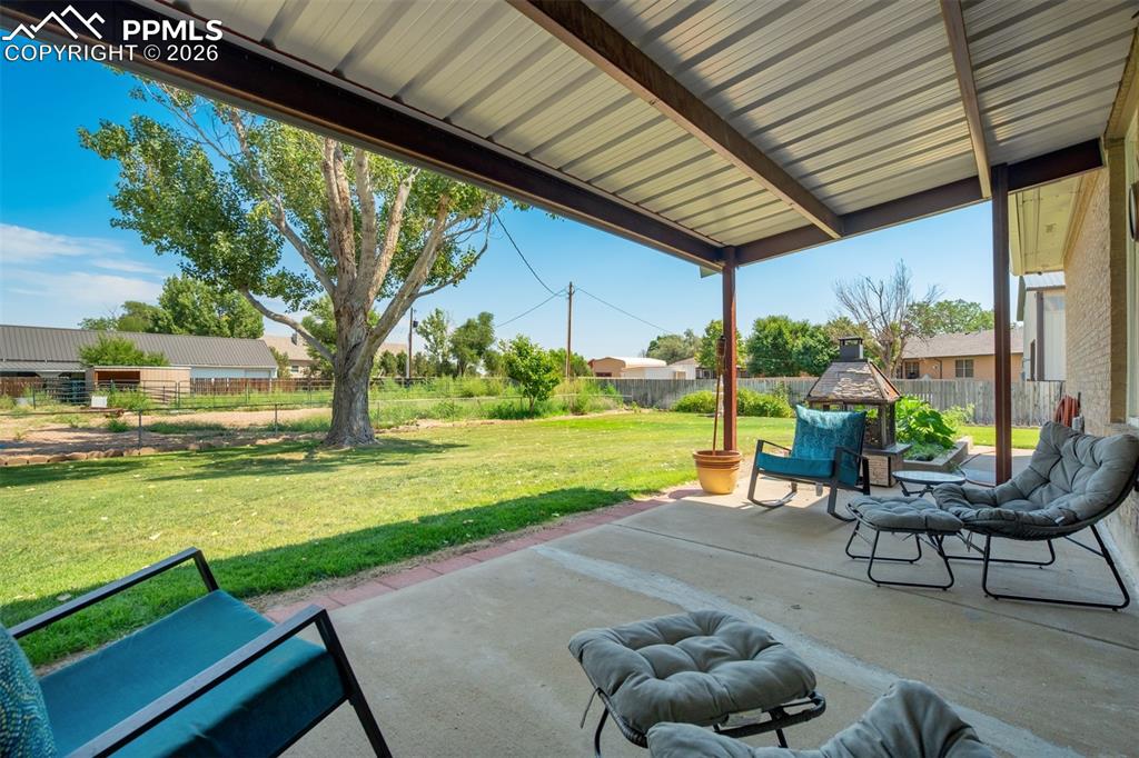 Fenced backyard with a patio area