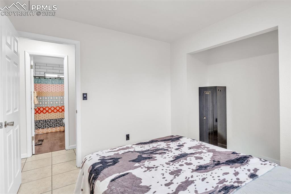 Bedroom with light tile patterned floors