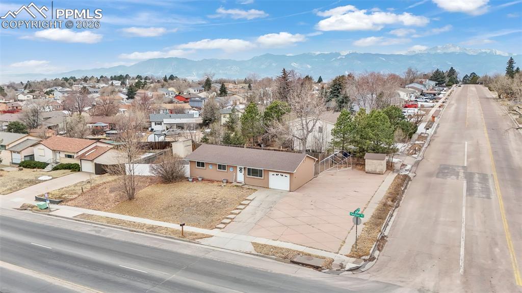 Aerial perspective of suburban area with a mountain backdrop