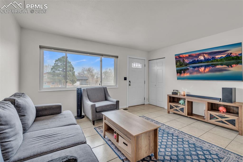 Living room with light tile patterned floors