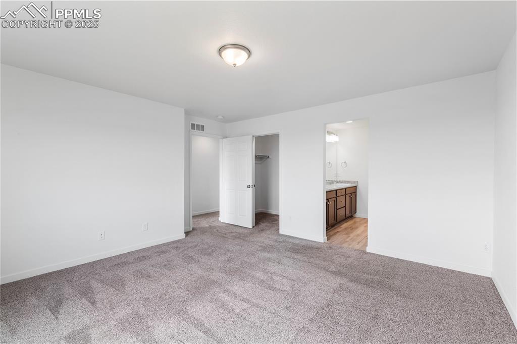 Large primary bedroom has a separate attached 3/4 bath