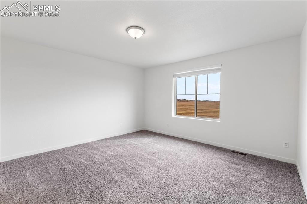 Another view of primary bedroom