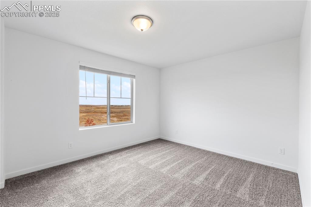 Huge office has a window facing South for lots of natural light