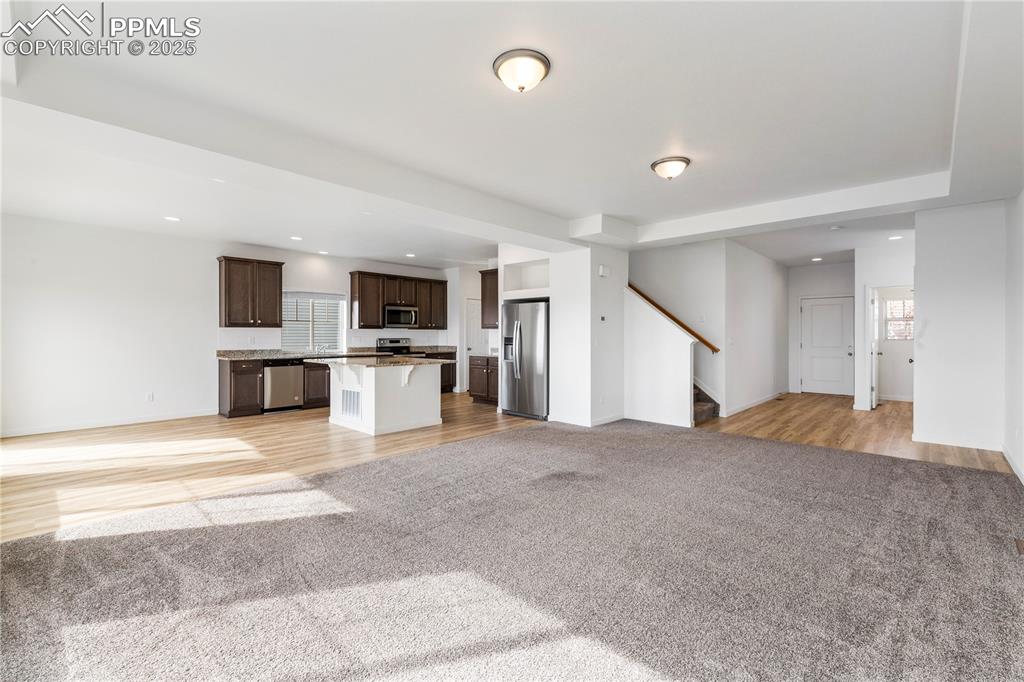 Living room opens to the kitchen